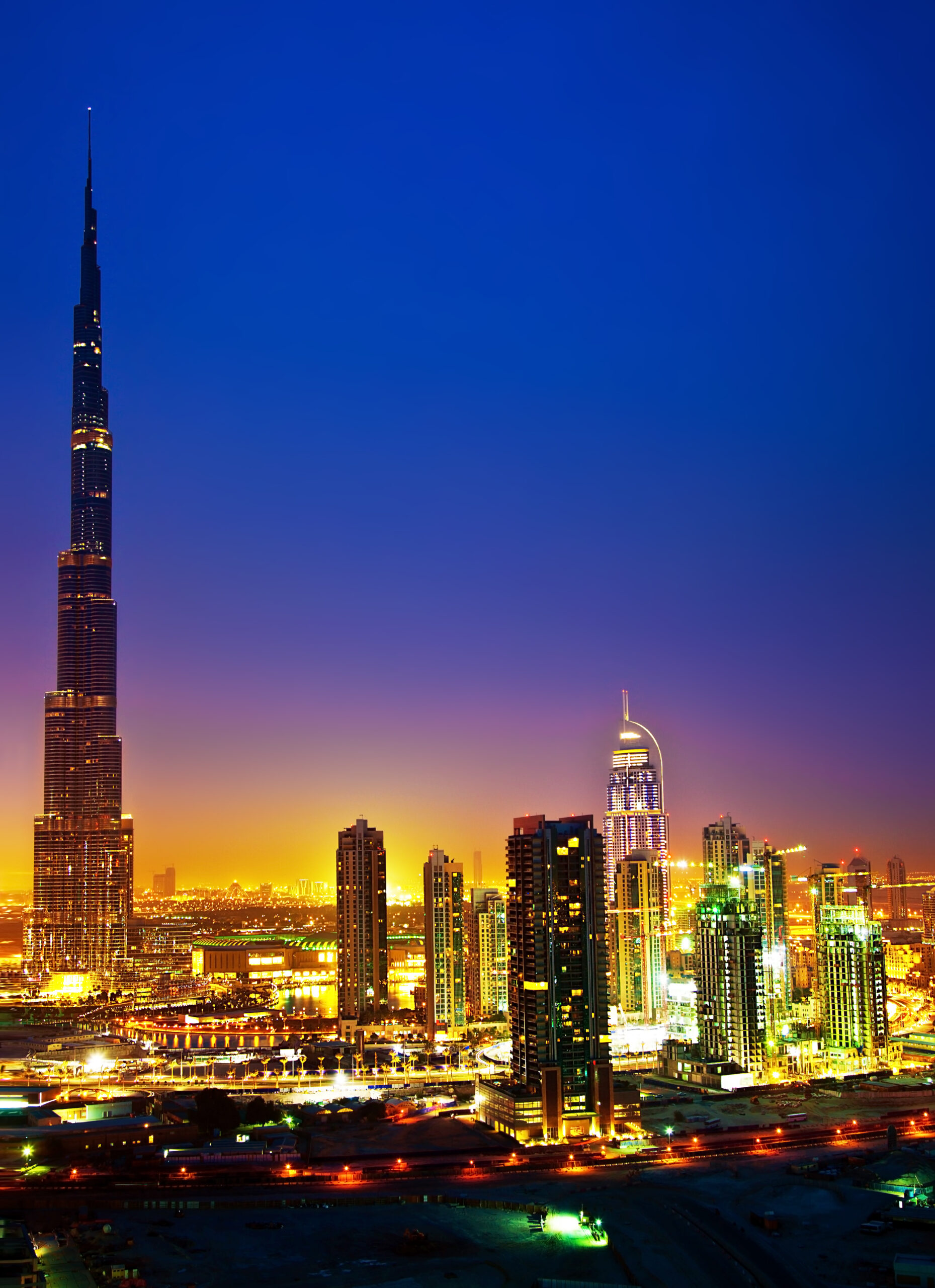 Dubai downtown night scene with city lights, luxury new high tech town in middle East, United Arab Emirates architecture